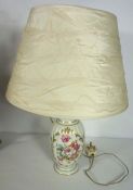 A Royal Crown Derby lamp base, decorated with flowers, together with two other table lamps, together