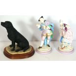 A pair of Dresden style figures of a Lady and Gallant, together with a resin model of a labrador (