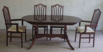 A modern reproduction dining suite, with six chairs and an extending table, 155cm long (7)