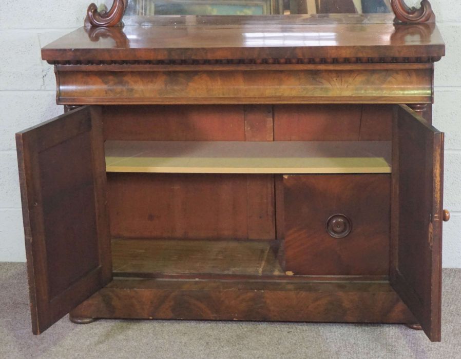 A mid Victorian mahogany chiffonier, circa 1850, with a scrolled mirrored back centred by stiff - Image 3 of 4