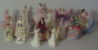 A large group of Royal Doulton bone china figures of ladies, including 'Autumn Breezes, HN.1911