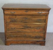 A walnut veneered Dutch style chest of drawers, 19th century, with a cushion front top drawer and