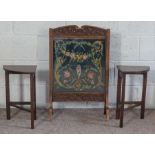 An oak framed tapestry fire screen, decorated with flowers, 79cm high; together with two small