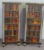 A pair of modern library style cabinets, each with doors dressed with faux leather book bindings,