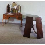 A mahogany veneered dressing table, with triple mirrored back and an arrangement of five drawers;