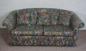 A modern sofa bed, with vibrant patterned material, 170cm wide