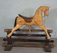 A modern carved childs rocking horse, made by 'Engineering in Wood', circa 2010, the horse with