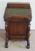 A Victorian style mahogany Davenport, with leathered hinged writing slope, four side drawers and