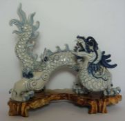 A large Chinese ceramic decorative 'Imperial' five clawed dragon, late 20th century. standing with