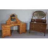 An early 20th century mahogany veneered dressing chest, with oval swing mirror, 154cm high, 107cm