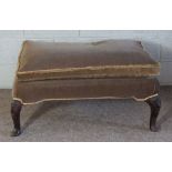 A George II style mahogany footstool, 18th century and later, currently upholstered in brown