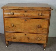 A small Victorian Dutch style walnut veneered chest of drawers, with a concave moulded top drawer