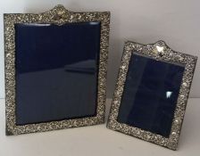 A graduated pair of silver mounted portrait frames, hallmarked Birmingham 1901/1903, maker Henry