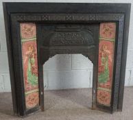 A cast iron and tiled coal fire surround, decorated with coloured tiles, each side with a lady