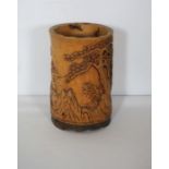 A 20th century Chinese carved bamboo brush pot, 18cm high; together with an assortment of objects