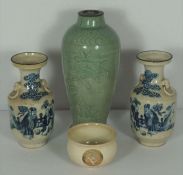 A pair of Chinese blue and white vases, Chenghua mark, with figures beneath clouds, 21.5cm high;