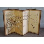 A Japanese decorative four fold screen, early 20th century, painted with finches on a flowering