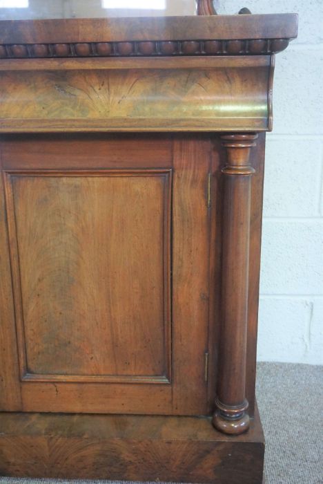 A mid Victorian mahogany chiffonier, circa 1850, with a scrolled mirrored back centred by stiff - Image 2 of 4