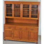 A large hardwood china display cabinet, modern, with glazed cabinets over a base with three