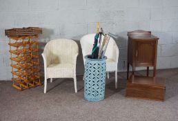 An Edwardian bedside cabinet; together with two Lloyd Loom style bathroom chairs, two wine racks,