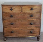 A mahogany bowfront chest of drawers, 19th century, with two short and three long drawers on