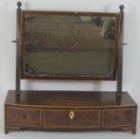 A George IV mahogany toilet mirror, on bowfront box plateau base, with three drawers, 53cm high,