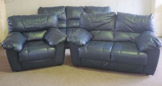 A modern large three piece blue leather suite, including an armchair, three seat and two seat sofas,