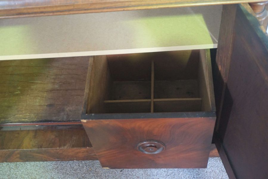 A mid Victorian mahogany chiffonier, circa 1850, with a scrolled mirrored back centred by stiff - Image 4 of 4