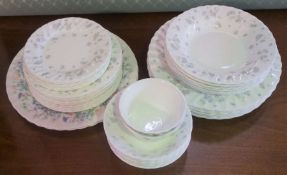 A Wedgwood bone china ‘April Flowers’ pattern part dinner service, comprising nine dining plates,