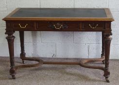 A Victorian walnut writing table, circa 1880, with an moulded rectangular top over three frieze