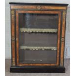 A Victorian ebonized and walnut veneered pier cabinet, with gilt metal mounts, with a single