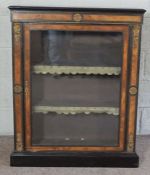 A Victorian ebonized and walnut veneered pier cabinet, with gilt metal mounts, with a single