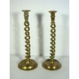 Two large double twist column brass candlesticks, 19th century, on dished bases, 35cm high; together