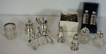 A small silver toast rack, hallmarked Chester 1908, 51g, 8cm long; together with a small leather