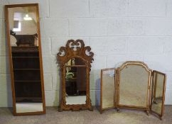 A George II style walnut fretwork wall mirror, together with a small swing mirror, a tall