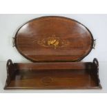 A 19th century mahogany book rack, with sidle handles, 68cm wide; together with an oval inlaid