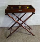 A mahogany folding butlers tray on stand, 19th century, with a square fold-out try top on a separate