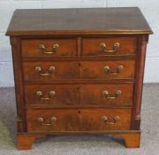 A small late George III mahogany chest of drawers, with two short and three long drawers within