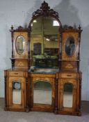 A large Victorian walnut veneered and marquetry dresser, late 19th century, with an arched glazed