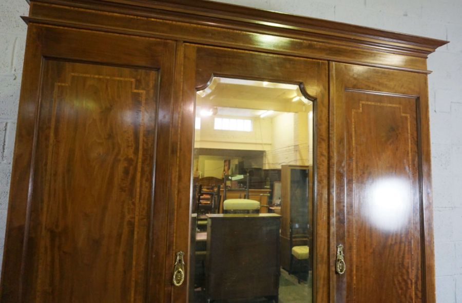 An Edwardian mahogany and satinwood banded triple wardrobe, with mirrored central door, over two - Image 5 of 5