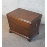 A George III style mahogany coal bowl, in form of wine cellarette of sarcophagus form, with hinged