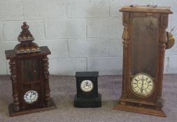 A Victorian mahogany cased wall clock, the case with turned pilasters, with an eight day barrel