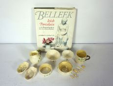 Assorted Belleek, including a Sligo commemorative cup, a jug and sugar bowl, decorated with