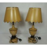 A pair of Toleware style urn table lamps, together with a large pair of pillar table lamps,