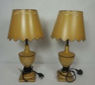 A pair of Toleware style urn table lamps, together with a large pair of pillar table lamps,