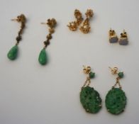 A pair of jadeite carved oval ear pendant earrings, together with another pair; also a pair of