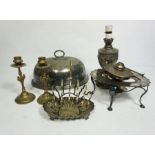 A quantity of silver plate and metal wares, including a pair of brass candlesticks, a converted