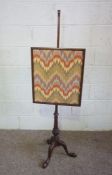 A Georgian style mahogany pole screen with zig zag embroidered screen, 148cm high