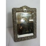 An Edwardian silver mounted dressing mirror, hallmarked Birmingham, 1903, the frame profusely