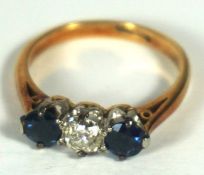 A sapphire and diamond three stone engagement ring, 18 carat gold setting, ring size J, the